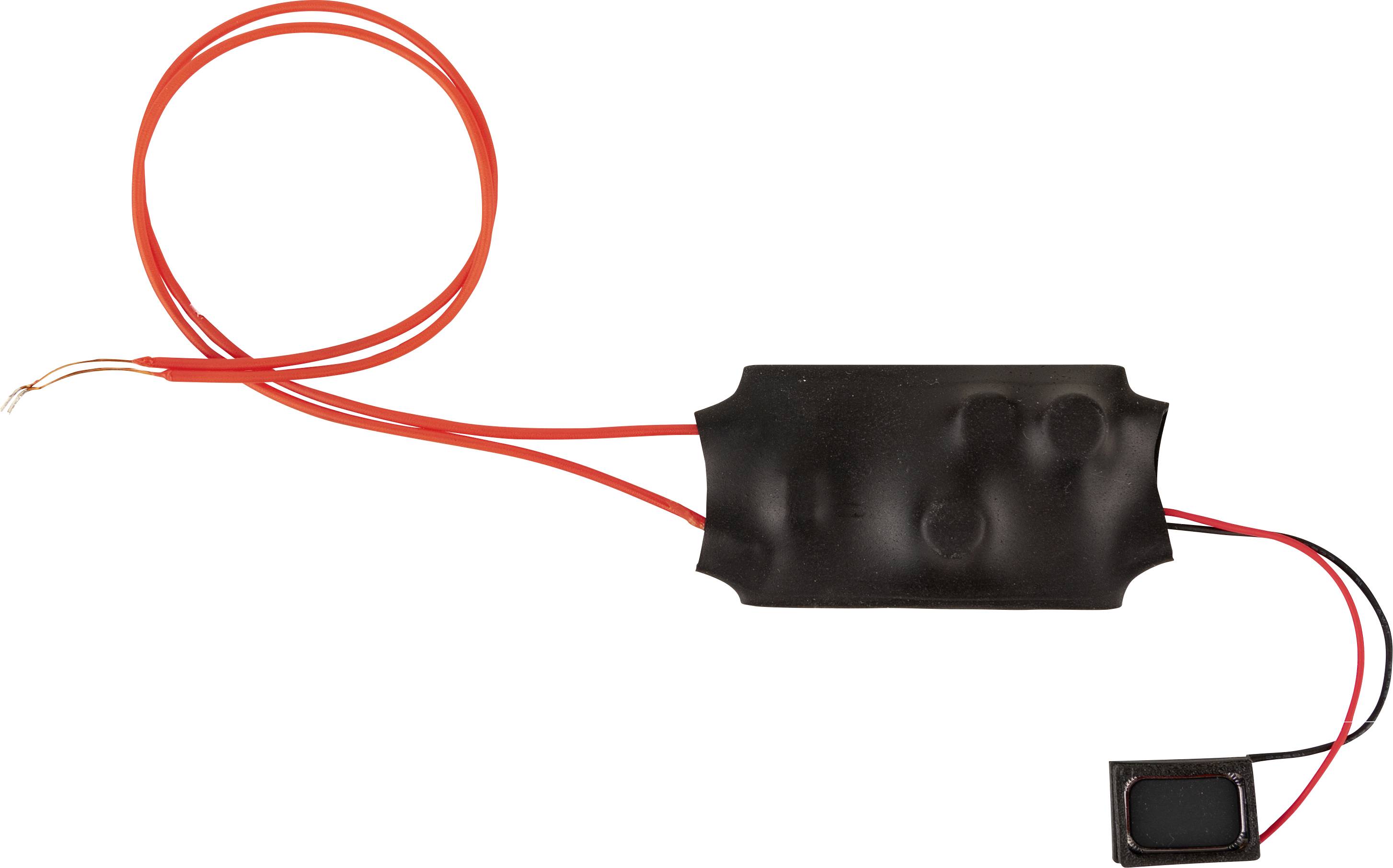 A black electronic component with red wires, with leads cut off on the left side, connected to a small rectangular module on the right.
