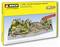 Model railway layout kit 'Easy-Track Andreastal' includes tracks, landscapes, and a bridge in a scenic mountain setting.