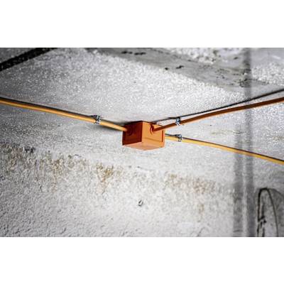 An orange junction box on the ceiling, with orange cables running in different directions. The ceiling surface is rough.