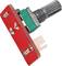 A red, square resistor component with metal threads and metal pins, possibly part of an electronic device.