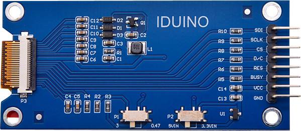 Electronic circuit board with the inscription 'IDUINO'. Contains various electronic components such as resistors and capacitors.