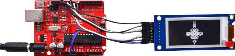 'Red circuit board connected with cables to a small screen displaying an electronics symbol.'