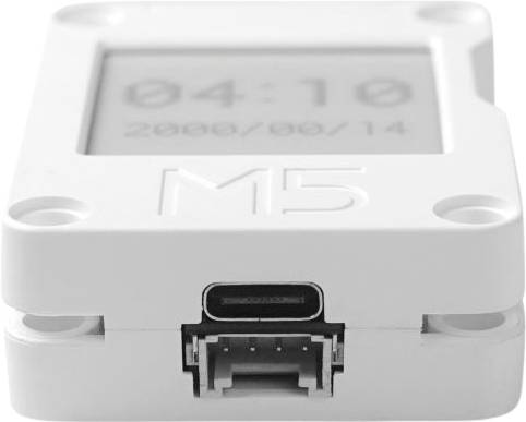 A small, white device with a display and USB-C port. The display shows '04:10 2000/09/14'. Device labelled with 'M5'.