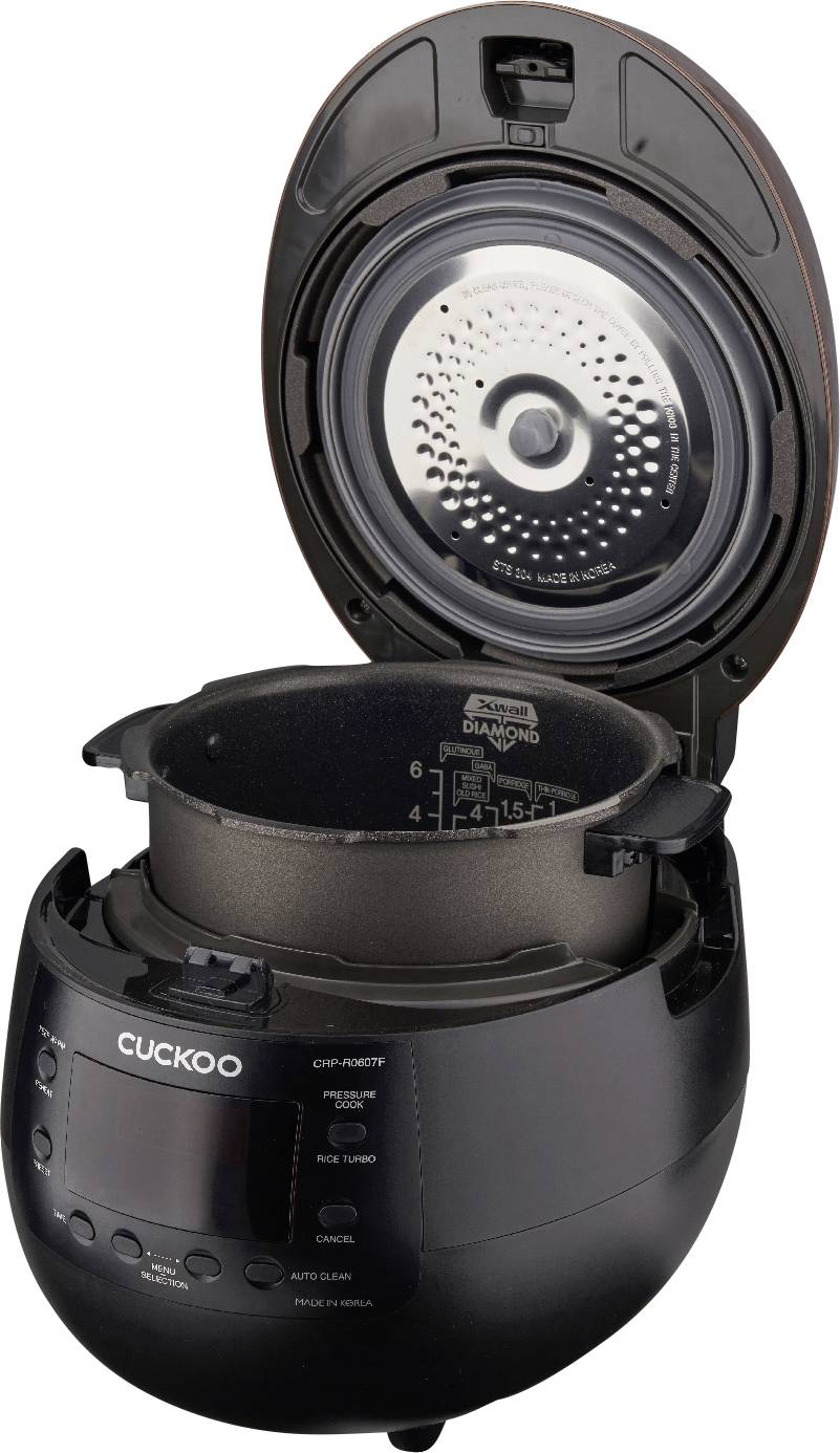 Black electric rice cooker with open lid, showing the inner pot with measuring scale; 'Cuckoo' brand on the front.