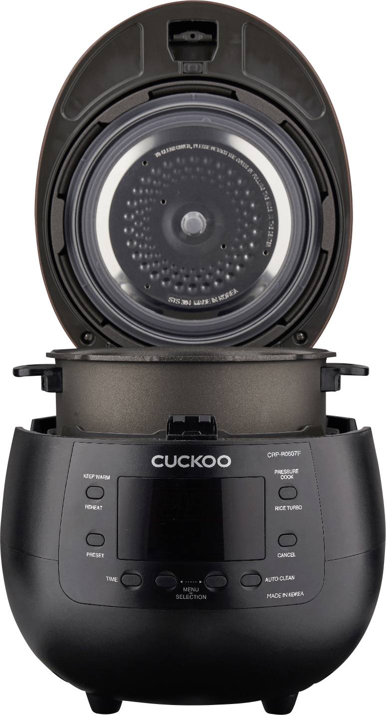 Electric rice cooker with an open lid, showing the inner pot and control panel with multiple functions. Brand 'CUCKOO'.