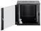 'Black wall-mounted server cabinet with open door, showcasing empty interior space and a small bag of installation hardware inside.'