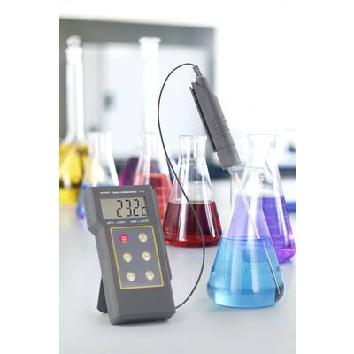 Laboratory thermometer reads 23.2°C in a blue liquid within an Erlenmeyer flask. Other flasks with coloured liquids are visible in the background.