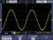 'Oscilloscope screen shows a yellow sine wave with 1.00 V amplitude at 200 µs/division.'