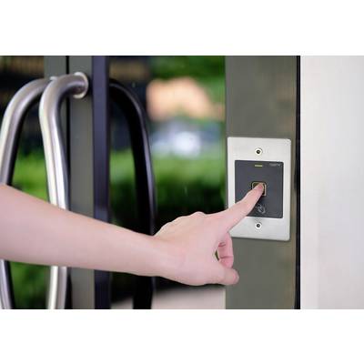 A hand is pressing on a fingerprint sensor on a door to grant access to a building.