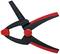 A black and red plastic spring clip with a serrated grip for holding objects.