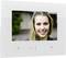 Colour video door intercom with a screen displaying the image of a smiling young woman.