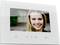 A white video doorbell screen displays the image of a smiling woman. Beneath are symbols for various functions.