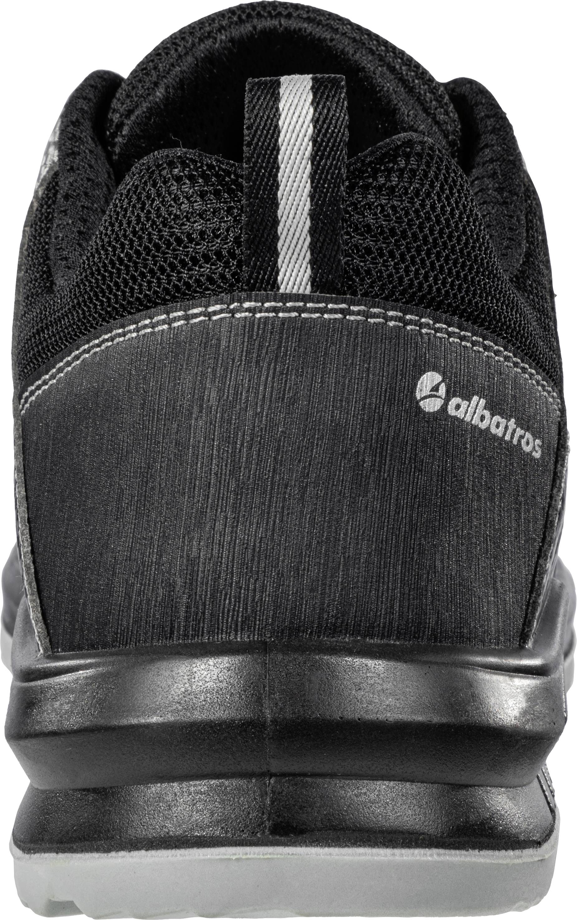 Black shoe from the rear, brand 'albatros', with mesh fabric details and reflective strips at the heel.