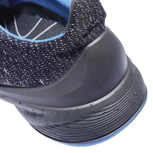 A black sports trainer with blue accents, focused on the heel, shows the sole tread and reinforced heel section.