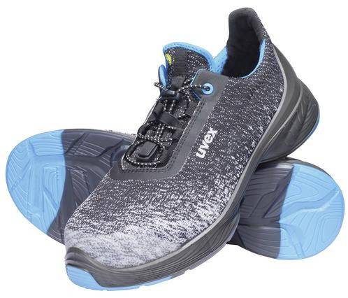 A pair of grey and blue trainers with non-slip soles and laces. They are positioned side by side.