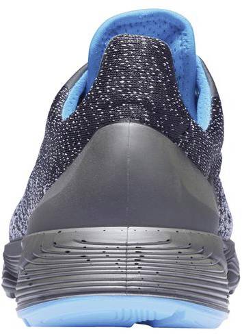 A sports shoe, photographed from behind, reveals a textured black upper with blue inner details and a blue sole.