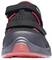 Black trainer with red details and touch-fastening straps, front view.