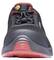 Black and red sports shoe, front view. Black upper material with red accents and laces, robust sole.