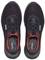 Black safety shoes with red accents, pictured from above. Shoes feature white logos and show lace-up design.