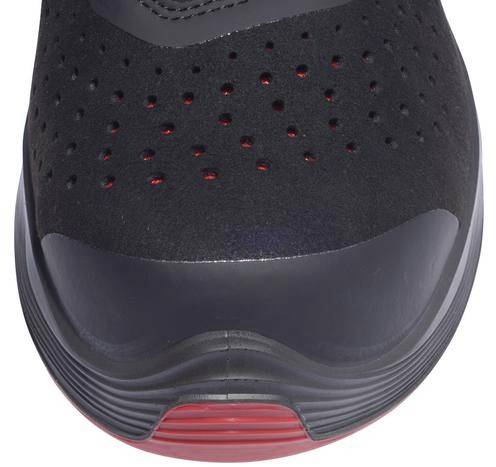 Black sports shoe with red accents on the sole, perforated upper material for ventilation. Front view, focus on the toe area.