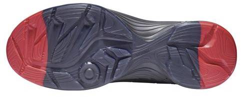 Shoe sole with dark blue and red areas, showing a complex profile for improved traction and stability.