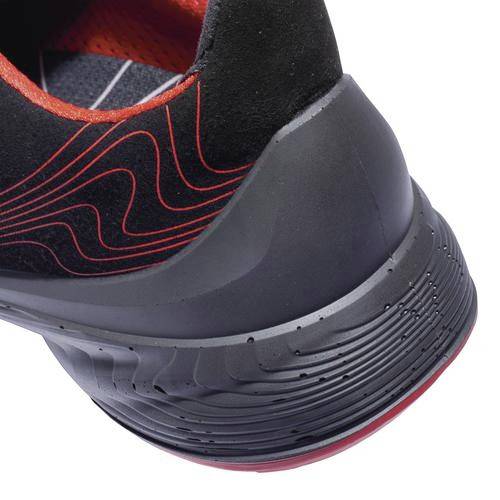 A black sports trainer with a red pattern and red interior padding. The sole is black with red accents.