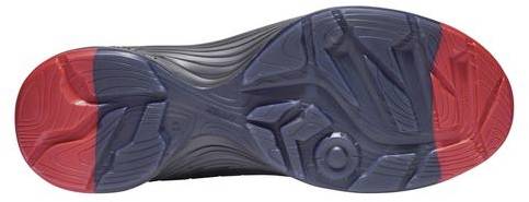 Sole of a sports shoe with red-highlighted heel and toe areas. The central section is dark blue with a textured profile.