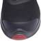 Black shoe with a red element on the sole, viewed from above. Simple, sporty design.