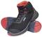 Black safety shoes with red inner lining and sole, UVEX logo on the side, modern lacing, robust construction.