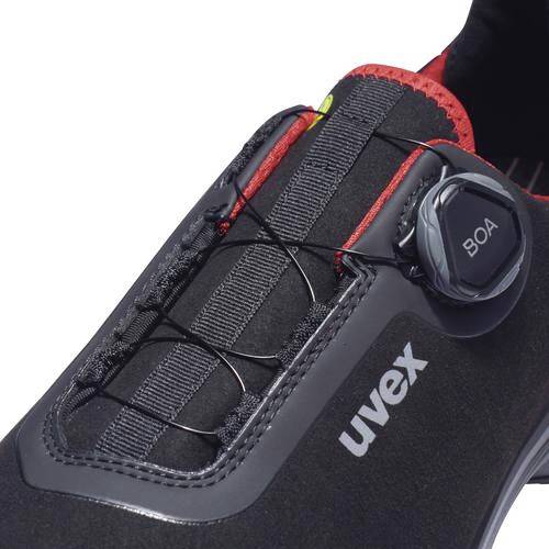 Stable, black work shoe with red inner lining and twist fastening at the top. 'uvex' brand label on the side.
