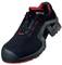 Black safety shoe with red inner lining and profiled sole. Uvex logo visible. Design emphasises robust and protective qualities.