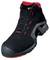 Black safety shoe with red accents and lacing, robust design for protection and comfort in work environments.