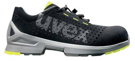 A black safety shoe with ventilation holes, grey sole and yellow accents, featuring the 'uvex' lettering on the side.