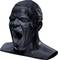 Black sculpture of a screaming male head with an open mouth. Expression of intense emotion.