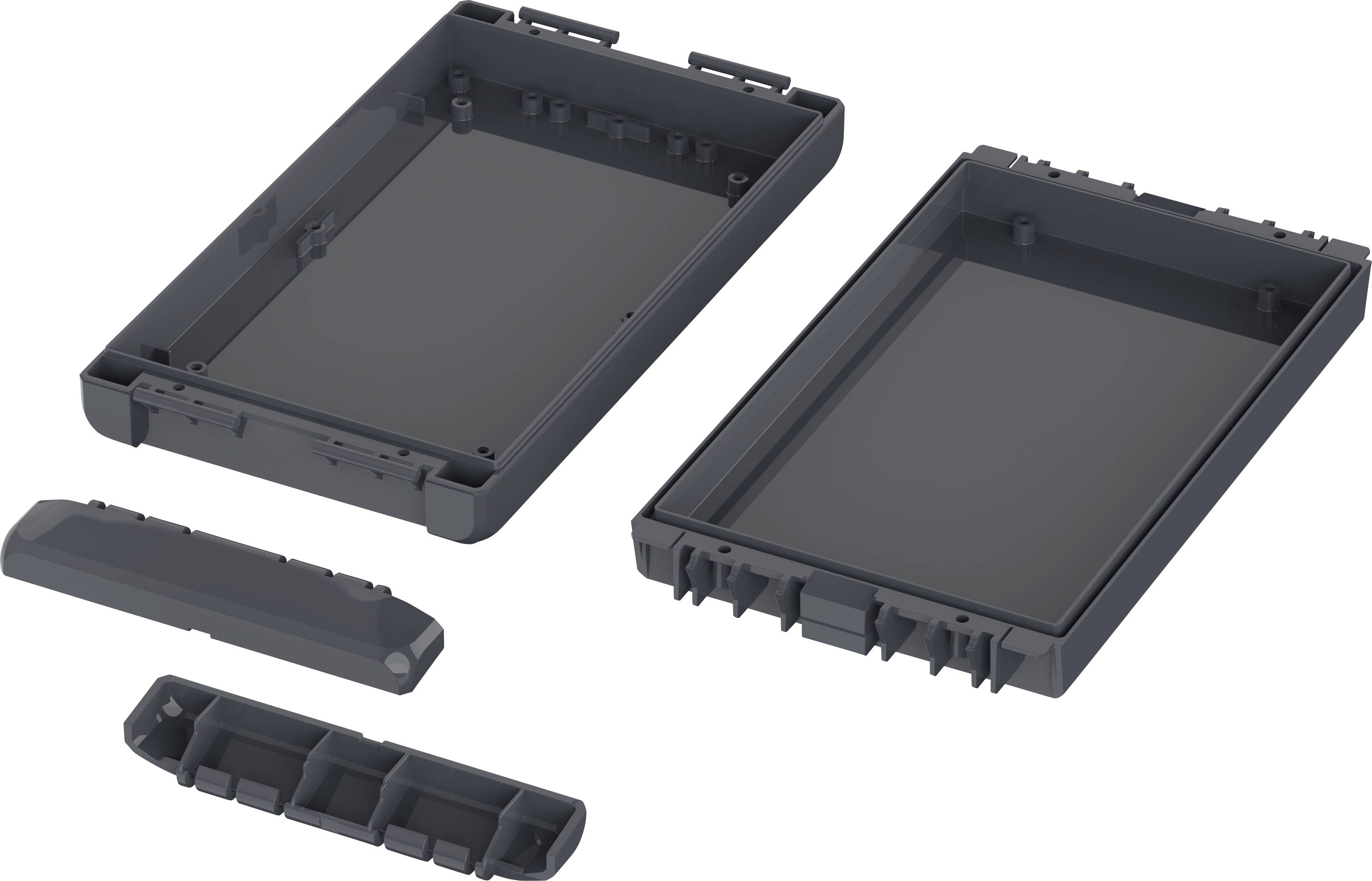 Two black plastic enclosures and two covers lying open next to each other reveal their inner structure.