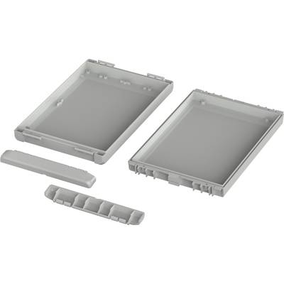 Housing parts for an electronic device, consisting of two halves and two smaller components, shown disassembled.