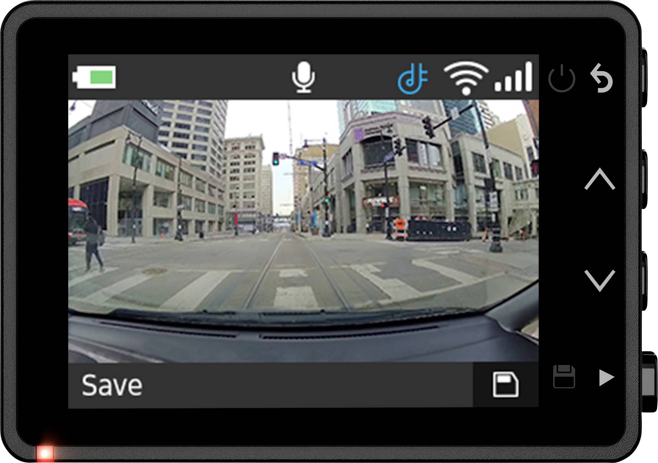 Dashcam display shows a city street with buildings and an intersection. Pedestrians are crossing the road, with traffic lights and road signs visible.