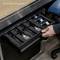 A drawer compartment with several microphones in protective padding. A hand reaches for a microphone. Text on the image: 'Equipment is not included'.