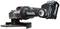A cordless angle grinder with a Makita logo, shown from the side. The device has a round grinding disc and a black handle.