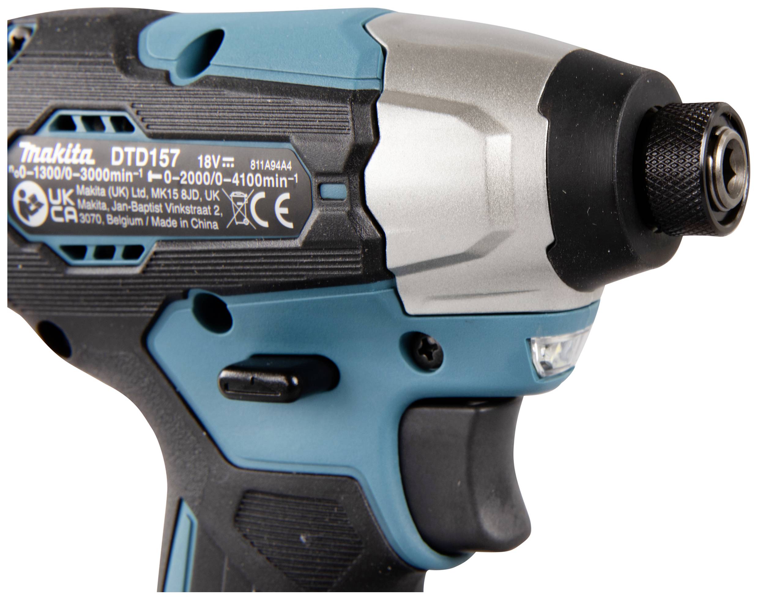 Close-up of a blue and black cordless impact driver with technical specifications on a label.