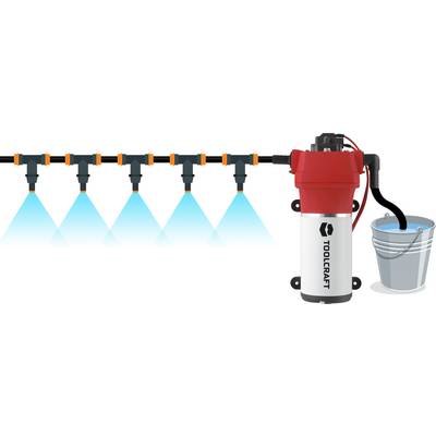 Pump system that sprays water from a bucket through nozzles. The main component is a red pump with the 'Toolcraft' logo.