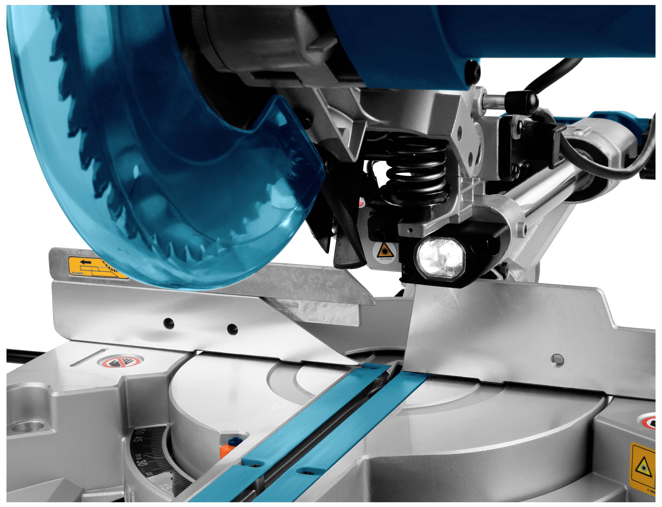 A close-up of an electric mitre saw with a blue saw blade, demonstrating the precision of the cutting angle and safety precautions.