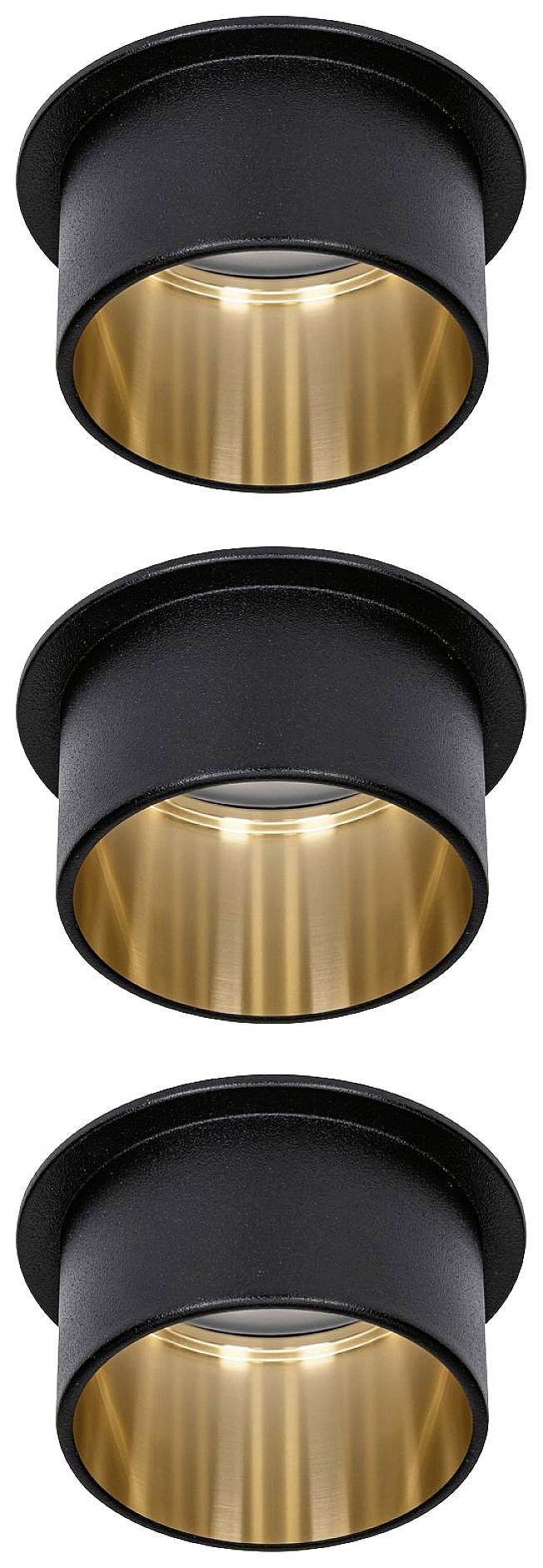 Three black cylindrical ceiling lights with golden interior coating, arranged in a vertical row.