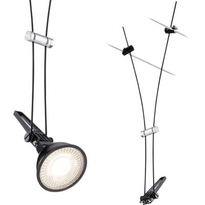 Black ceiling spotlight with cable suspension, housed in metal clamps, shines brightly. Cables are secured in clear holders.