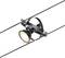 A black spotlight is mounted on a cable system. The lamp shines brightly and can be moved flexibly along the cable.