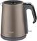 Electric kettle with a beige casing, black handle and lid, brand name 'Arzum Çay Sefası' on the front.