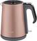 A pink electric kettle with a black handle and lid. The body of the kettle features the 'arzum' lettering.