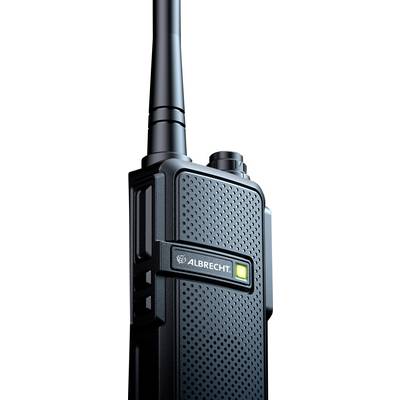 A radio transceiver with an antenna, black casing and a glowing green display. 'ALBRECHT' marking visible, device with a squared pattern design.