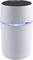 White, cylindrical Bluetooth speaker with a blue-illuminated ring in the centre, showcasing a wireless audio device design.