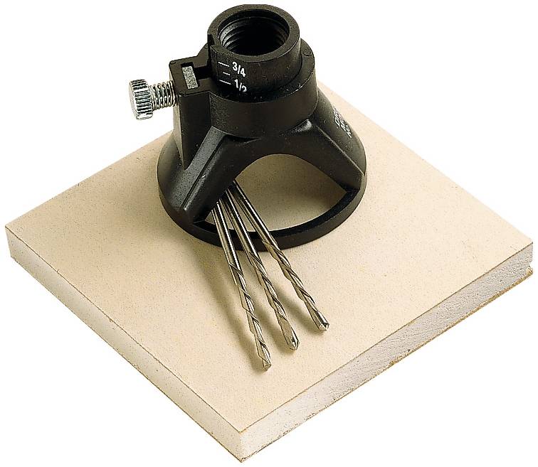 'Circular cutter attachment with drill bits on wooden board.'
